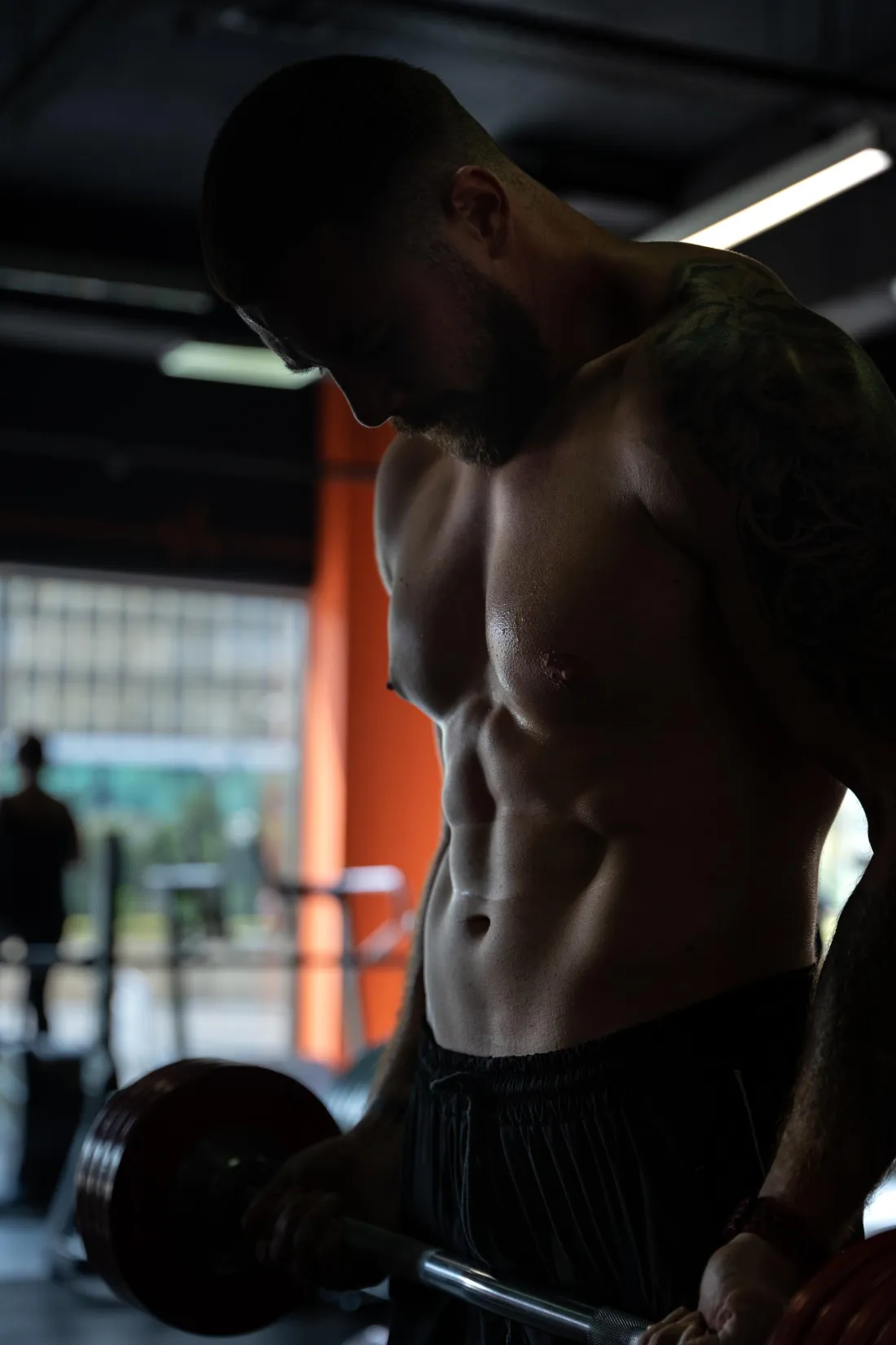 Man performing barbell curls