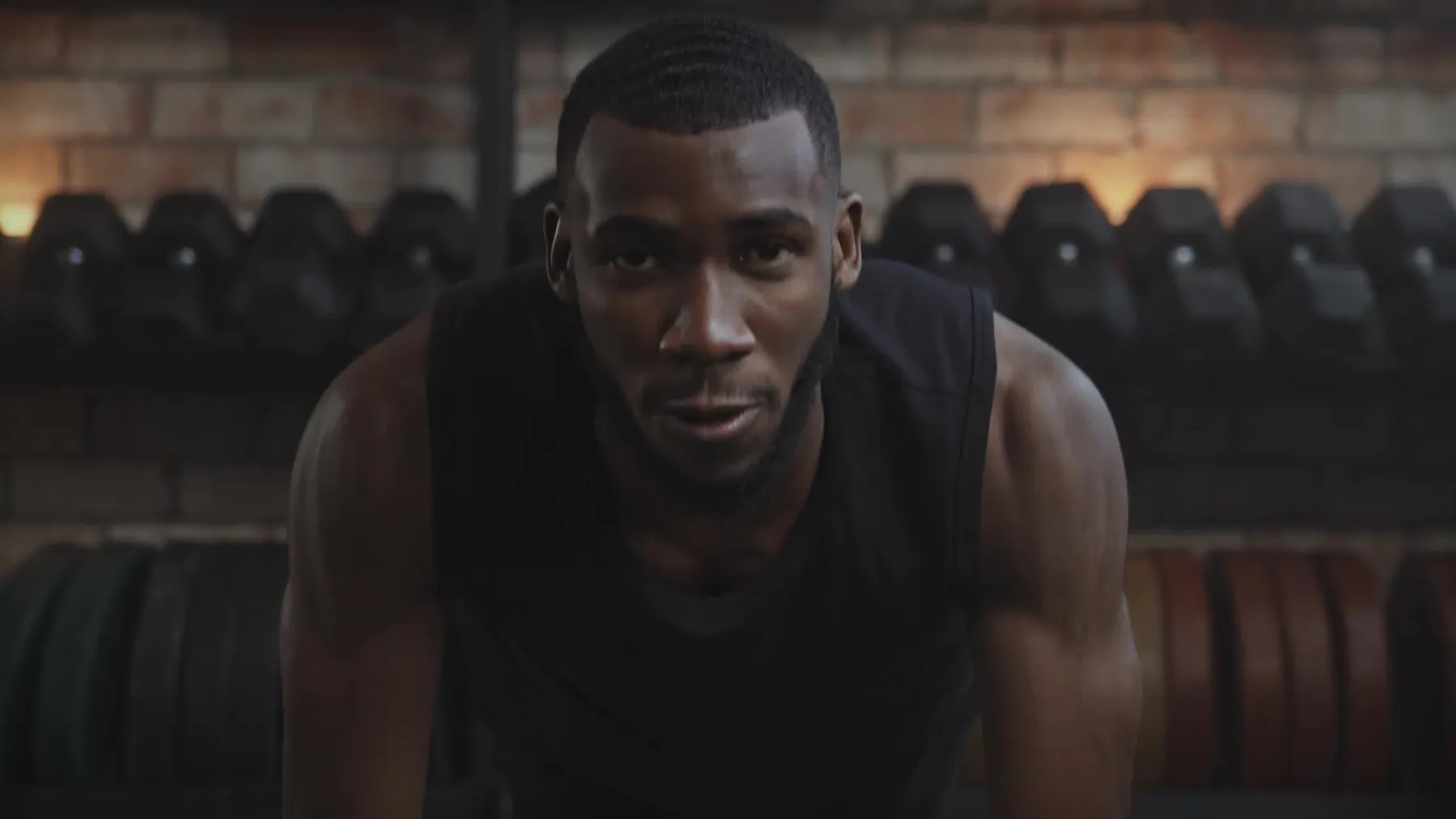 Man lifting weights in a gym