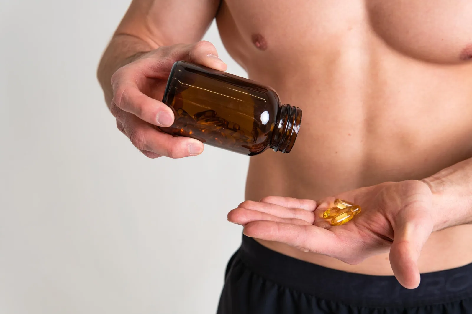 Softgel capsules being poured into a hand